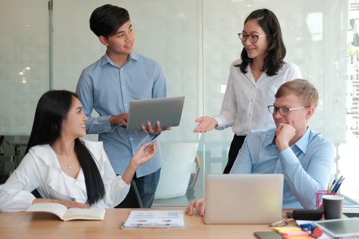 business people discussing on performance revenue in meeting. businessman working with co-worker team. financial adviser analyzing data with investor.