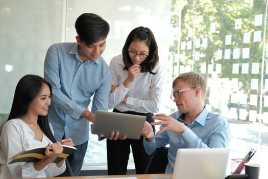 business people discussing on performance revenue in meeting. businessman working with co-worker team. financial adviser analyzing data with investor.