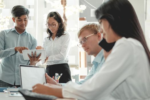 business people discussing on performance revenue in meeting. businessman working with co-worker team. financial adviser analyzing data with investor.