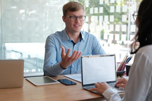 business people discussing on performance revenue in meeting. businessman working with co-worker team. financial adviser analyzing data with investor.