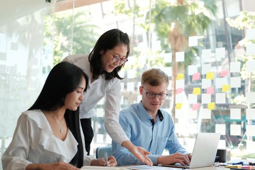 business people discussing on performance revenue in meeting. businessman working with co-worker team. financial adviser analyzing data with investor.