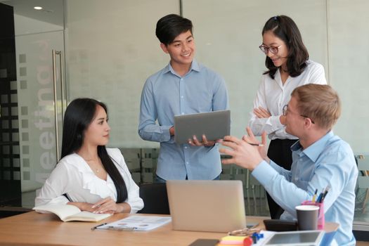 business people discussing on performance revenue in meeting. businessman working with co-worker team. financial adviser analyzing data with investor.