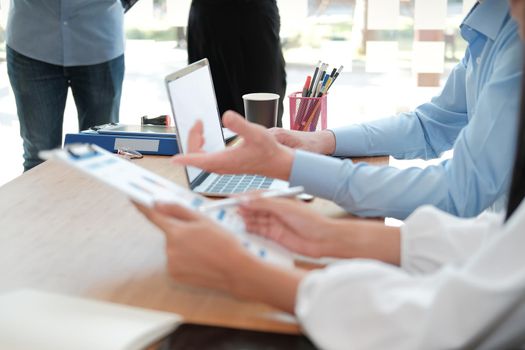 business people discussing on performance revenue in meeting. businessman working with co-worker team. financial adviser analyzing data with investor.