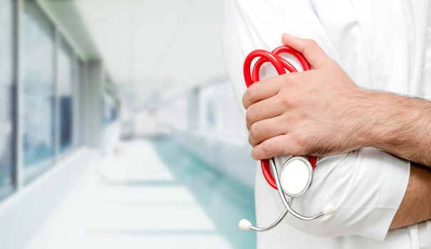 Young male doctor working at the hospital. Medical healthcare and doctor staff service.