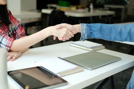 asian girl teenager friends shaking hands for startup project. teamwork, friendship concept