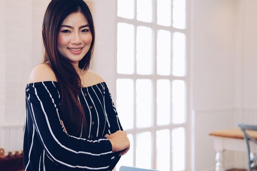 young asian woman smiling posing at home