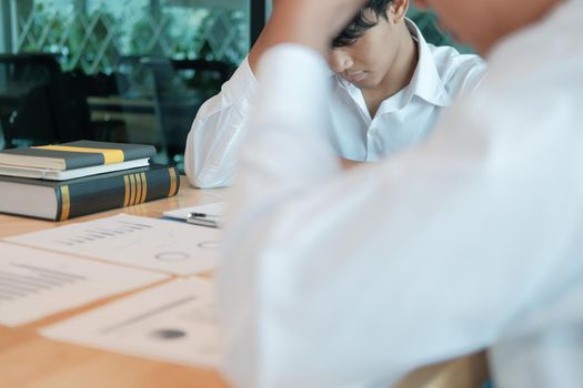 man feeling tired, frustrated stressed from hard work. exhausted businessman have headache at workplace.