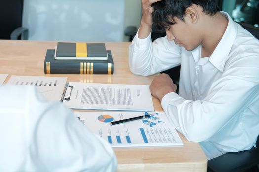 man feeling tired, frustrated stressed from hard work. exhausted businessman have headache at workplace.