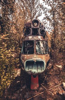 Abandoned broken cabin of historical old USSR helicopter technique lost in the nature
