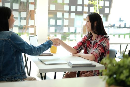 asian girl teenager friends shaking hands for startup project. teamwork, friendship concept