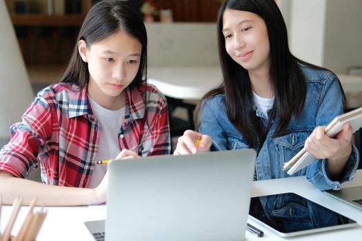 girl teenager college high school student studying with computer laptop