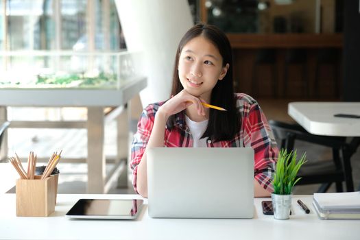 girl teenager college high school student studying with computer laptop