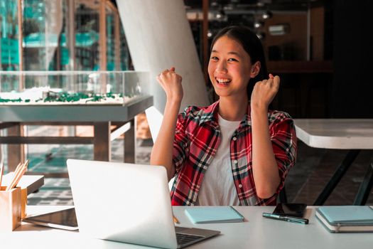 happy asian woman girl teenager raising hands with gladness happiness