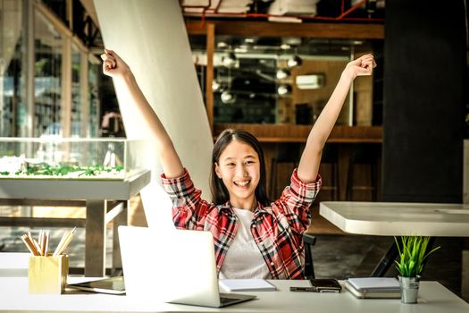 happy asian woman girl teenager raising hands with gladness happiness