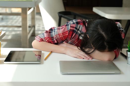 woman sleeping at workplace. girl tired exhausted from hard work