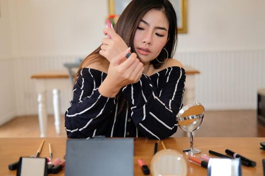 beauty blogger live broadcasting cosmetic makeup tutorial on social media. vlogger recording vlog video. influencer marketing