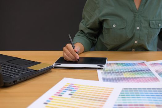 graphic interior designer working with computer. creative man drawing with digital tablet & stylus pen at modern office. business, technology, design and people concept