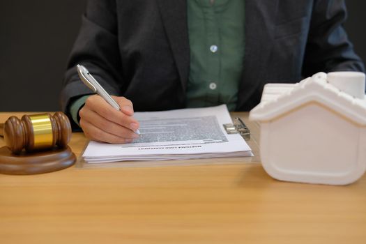 businessman lawyer work with mortgage loan contract agreement buying selling & renting real estate property