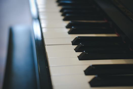 piano keyboard with glossy black & white keys. classic music instrument