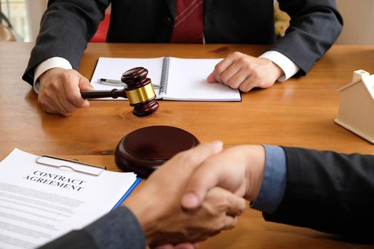 businessman shaking hands with lawyer after discussing auction contract agreement. handshaking after meeting at law firm.