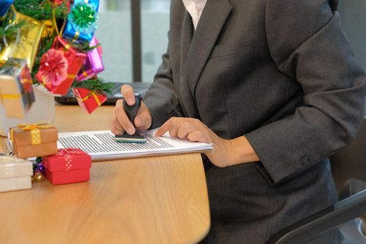 businessman using stamper for stamping approved on contract agreement document during christmas holiday