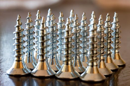 Close up of screws on a table. Advertising photo