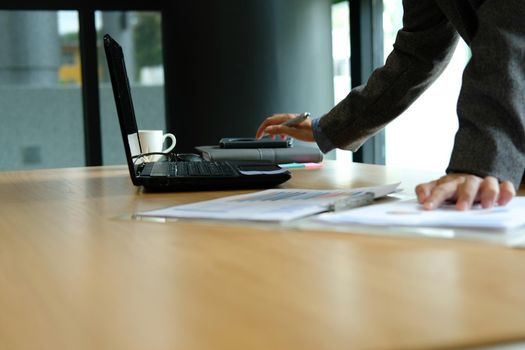 businessman analyze financial graph chart at workplace. startup man working with plan report document at office.