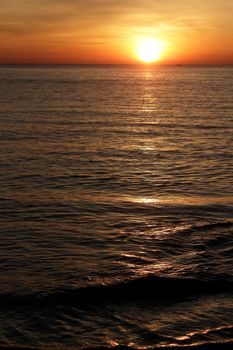 photograph of the sunrise from the sea and the beautiful sky and morning clouds