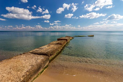 Beauty seashore with a big concrete pier