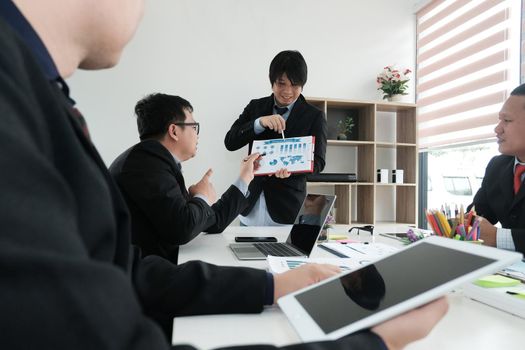 business people having a meeting. businessman working with financial plan report. startup man discussing idea at workplace. teamwork, corporate concept.