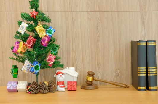 decorated christmas tree judge gavel & law book. lawyer attorney justice workplace at xmas new year holiday festival.