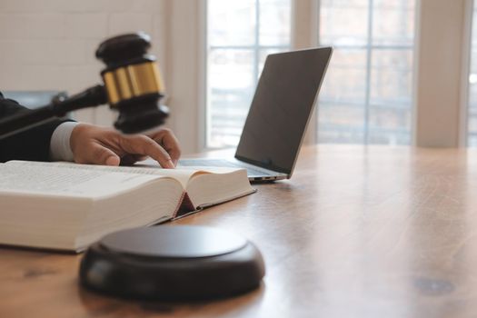 judge holding legal law gavel with book at courtroom. lawyer attorney justice at court