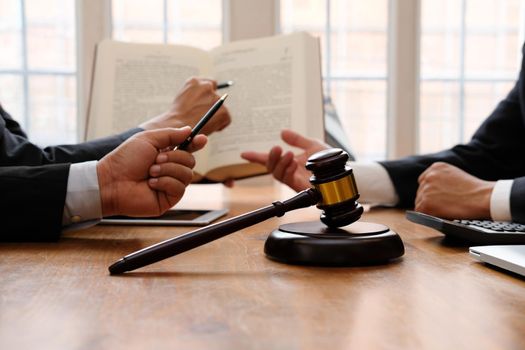 lawyer giving advice to business people. businessman discussing legal legislation at law firm. judge gavel & team meeting at courtroom