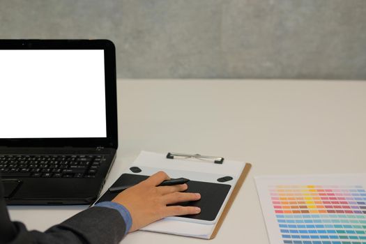 interior designer artist working on graphic tablet at office. photographer retouch photo. design creativity concept