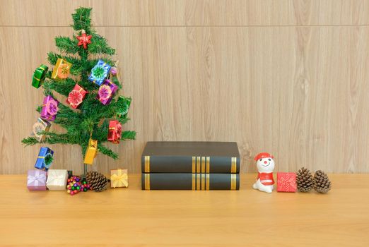 decorated christmas tree & book. xmas new year holiday festival.