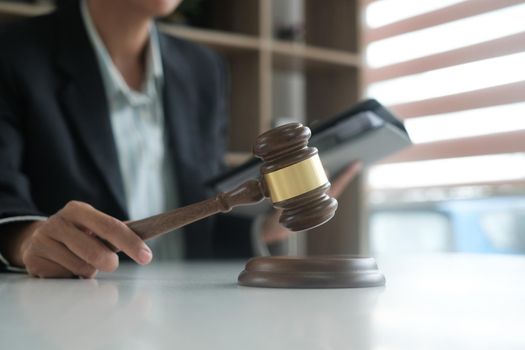 judge holding legal law gavel & book. lawyer attorney justice workplace