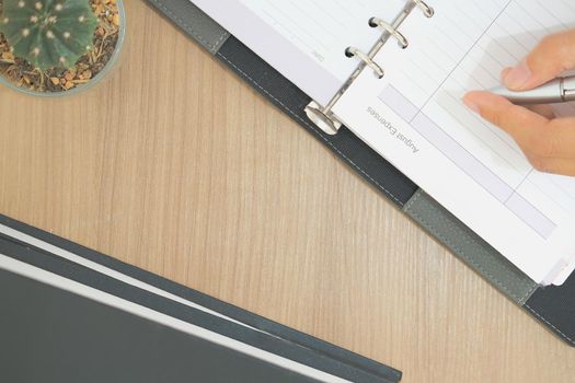 notebook book on wooden desk table. office workplace top view. education concept. succulent cactus plant in pot