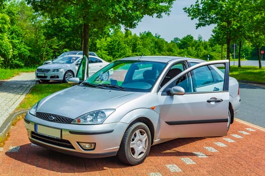 Lower Saxony Germany 18. June 2013 A sporty silver car parked on a parking lot at the highway motorway speedway in Lower Saxony Germany.