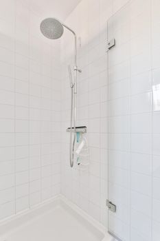 Modern shower stall in a bright bathroom