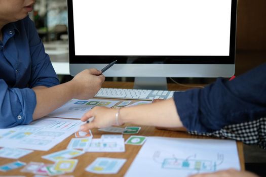 user experience UX designer designing web on smart phone layout. UI planning mobile application. developer work with business prototype