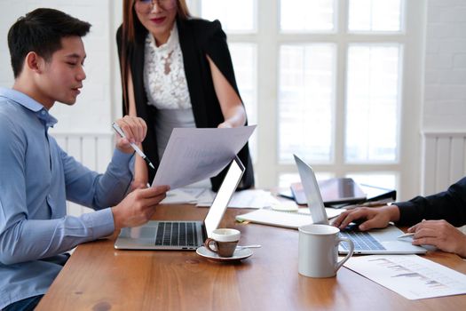 executive businesswoman advising analyzing discussing business project with co-worker team