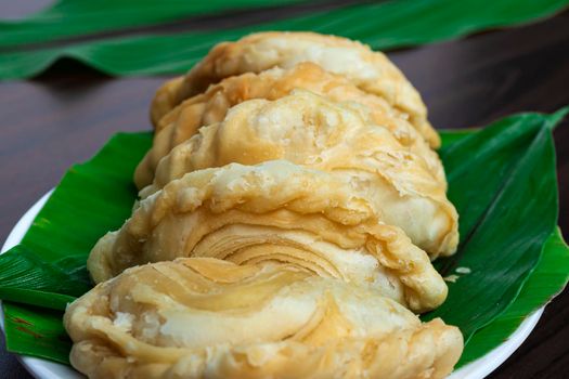 Malaysia popular and traditional snack Karipap or curry puff filled with potato fillings.