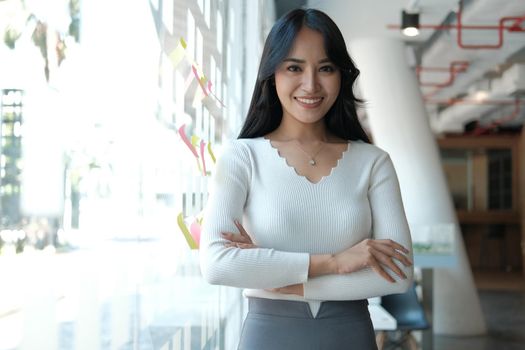 young confident asian executive businesswoman woman smiling at business workplace