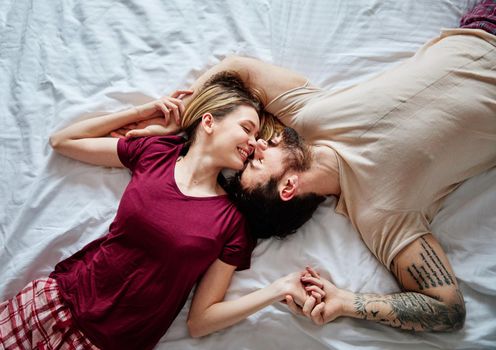 Portraitof a young couple sharing an intimate moment in bed