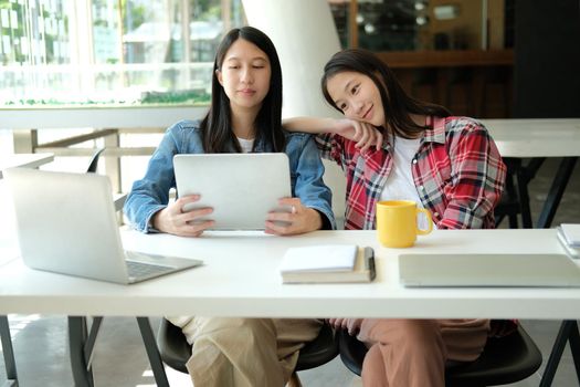 girl teenager college high school student studying with tablet computer laptop