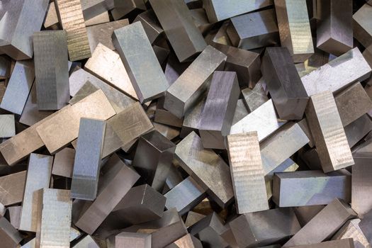 pile of cuboid steel workpieces after parallel surface grinding