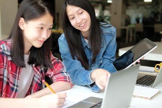 girl teenager studying with tablet computer laptop. college high school student taking note