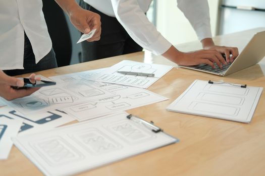 user experience UX designer designing web on smart phone layout. UI planning mobile application. developer work with business prototype