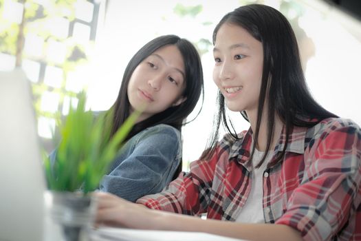 girl teenager college high school student studying with computer laptop