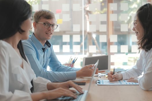 business people discussing on performance revenue in meeting. businessman working with co-worker team. financial adviser analyzing data with investor.